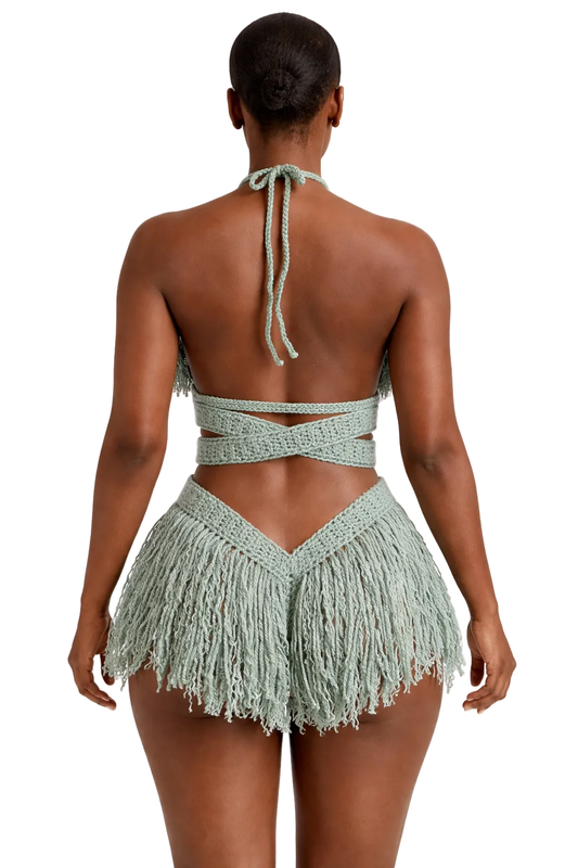 Model wearing the Light Sage Hebe crochet one piece, size M, by TaniJay Crochet.