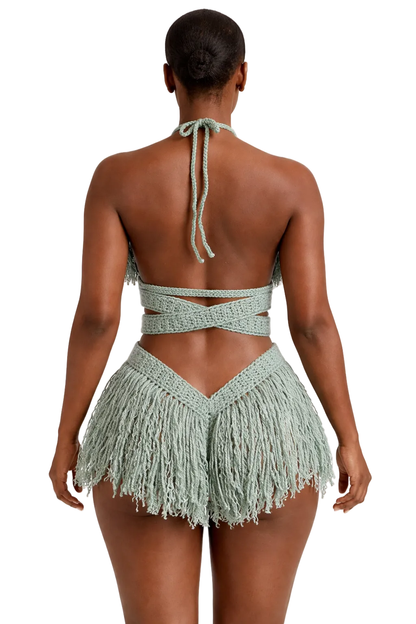 Model wearing the Light Sage Hebe crochet one piece, size M, by TaniJay Crochet.