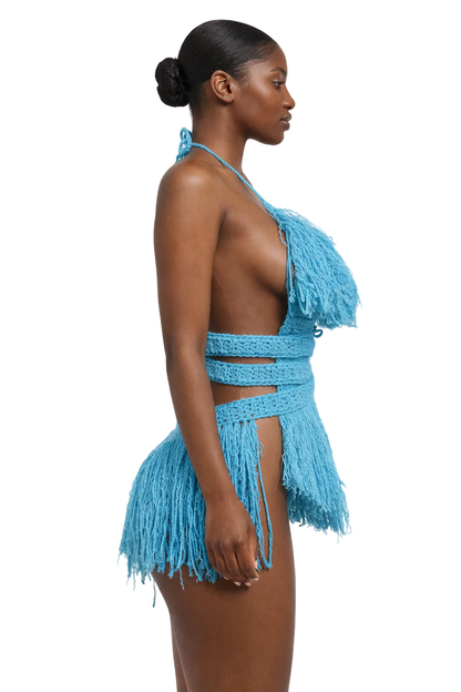 Model wearing the Turqua Hebe crochet one piece, size M, by TaniJay Crochet.