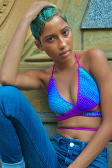 Polo Stripe Aphaea crochet wrap top with contrasting panels and wraparound waist ties, close seated front view